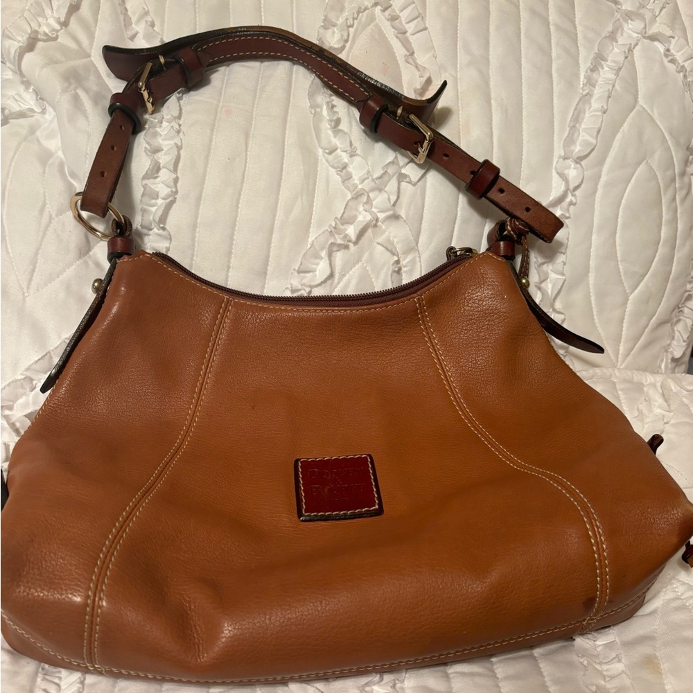 Dooney and Burke used handbag, sold as is according to pictures.